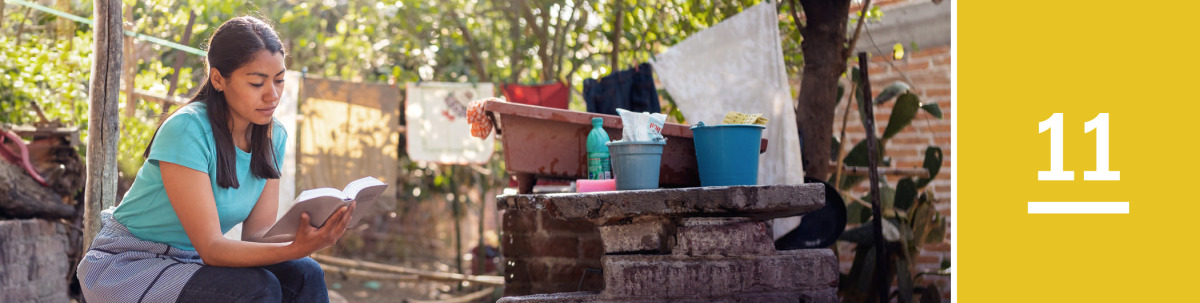 Image 1: A woman reads the Bible during a break from her household chores.