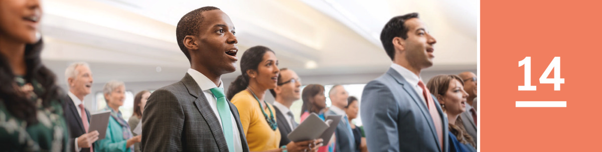 Image 1: A group of Jehovah’s Witnesses and visitors sing at a congregation meeting.