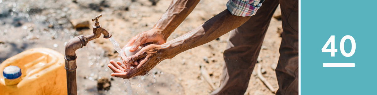 Image 1: A man washes his hands with soap and water.