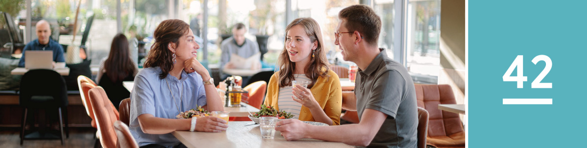 Image 1: A single sister and a married couple happily talk in a café.