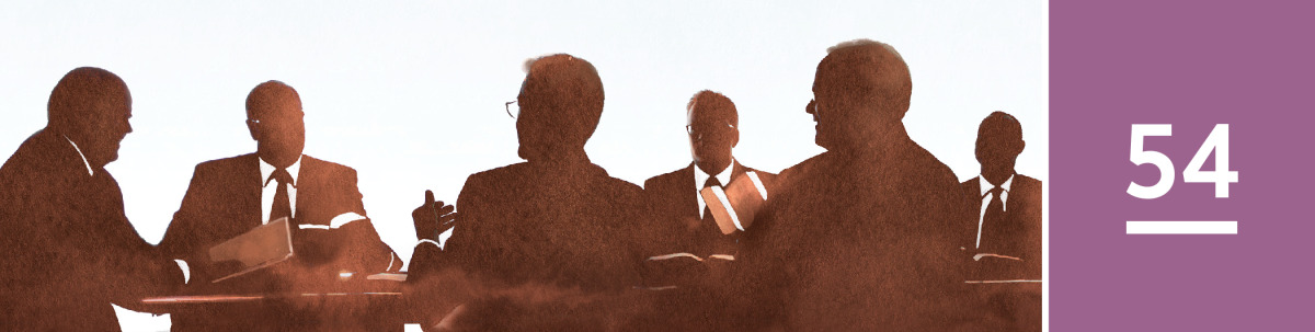 Image 1: Members of the Governing Body of Jehovah’s Witnesses meeting together.