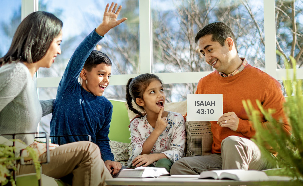 IMAGE 2 PICTURE DESCRIPTION: During family worship, parents use flash cards to help their children memorize scriptures CAPTION: Memorizing scriptures and Kingdom songs now can serve you well during persecution (See paragraph 9)