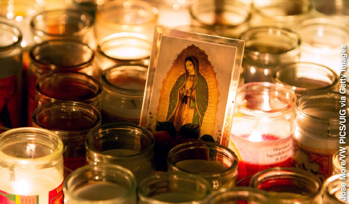 IMAGE 5 PICTURE DESCRIPTION: Lighted candles surround a picture of Mary during the Fiesta of Our Lady of Guadalupe CAPTION: Fiesta of Our Lady of Guadalupe