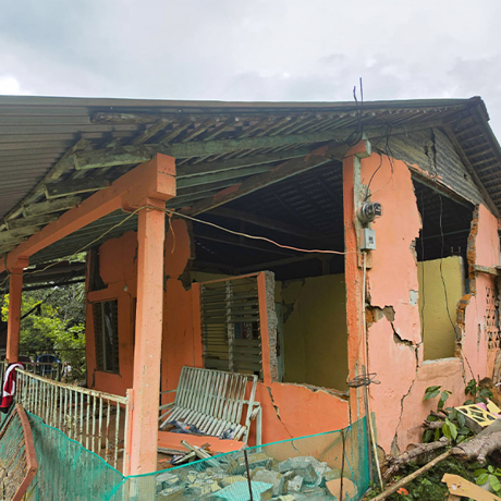 The severely damaged home of a member of Jehovah's Witnesses in Los Pozos, Panama